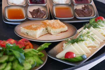 turkish breakfast of cheese, cucumber, egg, olive and tomato