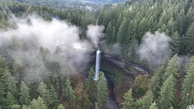 A wispy cloud drifts above the magnificent South Falls in Oregon. The entire Pacific Northwest is known for its spectacular outdoor scenery, including mountains, rivers, waterfalls, and coastline.