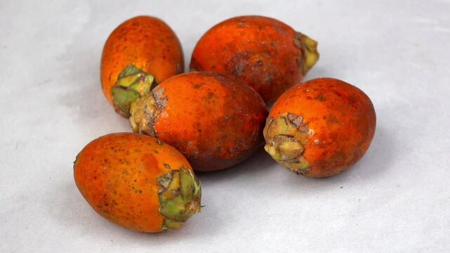 Fresh ripe betel nuts, scientifically known as Areca catechu, are the fruits of the areca palm.