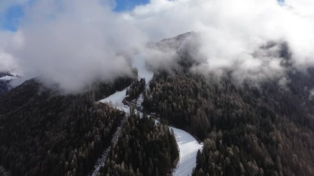 This is a large ski area that prepares Cortina 2026 in Italy. The locations are captured with a drone that shows the beauty of winter sports that combine blue sky, white snow and