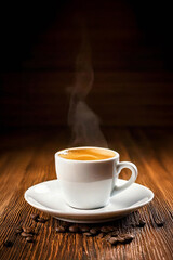 Fresh espresso cup of coffee with hot steam