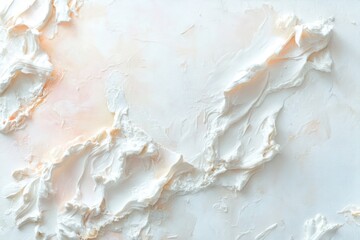 Creamy white textured surface with subtle peach undertones abstractly displayed