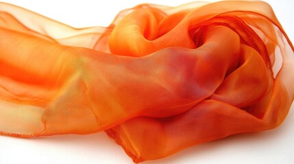 Vibrant orange silk scarf elegantly draped on a white background, showcasing its delicate texture