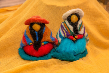 Hand-woven dolls with natural wool, earthy colors, reinforce the connection with nature, an...