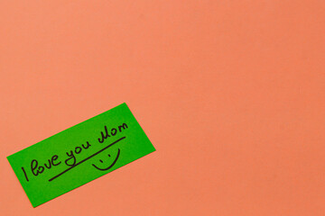 Heartfelt message for mom on bright green note with happy face