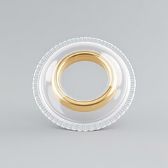 A gold ring is on top of two plastic rings.