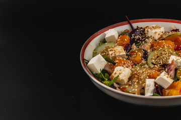 Delicious colorful salad with fresh ingredients and creamy feta cheese