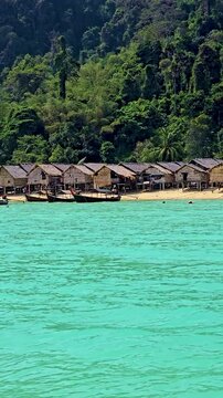 Explore the stunning surroundings of Surin Island where traditional huts meet breathtaking nature. Experience peaceful beach vibes, vibrant marine life, and a rich cultural atmosphere.