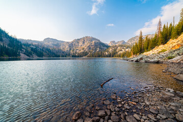 Afternoon Sun Filtering Onto Alpine Lake