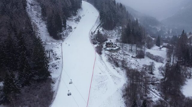This is a large ski area that prepares Cortina 2026 in Italy. The locations are captured with a drone that shows the beauty of winter sports that combine blue sky, white snow and lovely