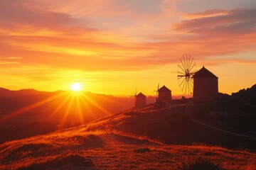 Windmills on hill at sunset, golden light for travel, tourism or background use