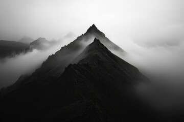 Black Mountains rising above fog, peak landscape scenery, travel editorial