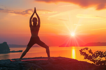 Yoga practice at sunset with beautiful sky hues and peaceful nature background. Ideal for concepts of wellness, balance, and natural living in a serene atmosphere