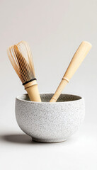 Traditional Japanese tea tools in a serene setting.