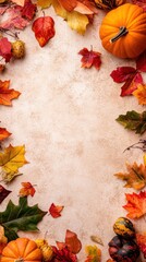 A festive autumn background featuring colorful leaves and pumpkins.