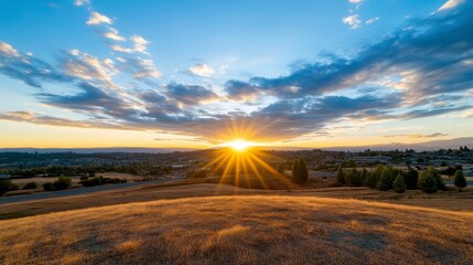 Golden Sunset Over Rolling Hills with Cityscape Silhouette and Dramatic Cloudy Sky