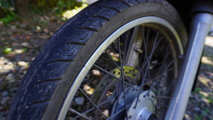 Close-up of a Motorcycle Tire with Brand and Model Engraving