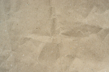 Grunge vintage old paper background. Brown crumpled paper texture.