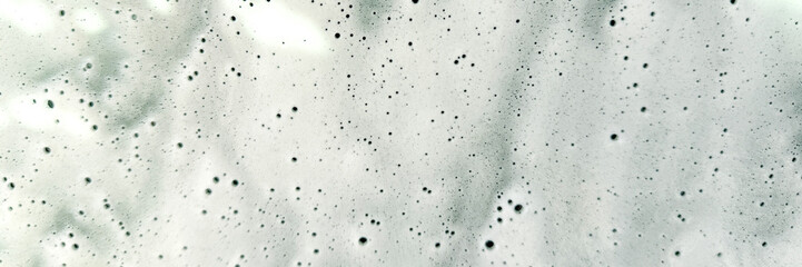 Marble texture with small black spots, elegant abstract background, interior design, natural stone pattern