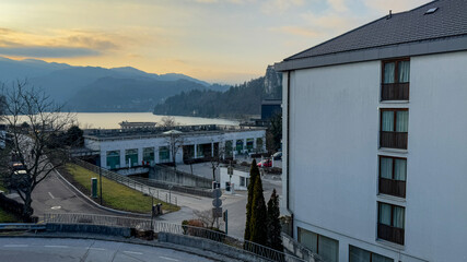 Fototapeta premium Scenic lakeside view with mountains, peaceful morning landscape, relaxing getaway winter travel destination Bled, Slovenia 