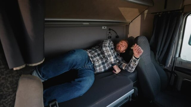 Truck driver falling asleep in cabin during rest