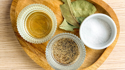 Herbs and spices on a wooden tray, culinary seasoning, gourmet cooking, Mediterranean cuisine display