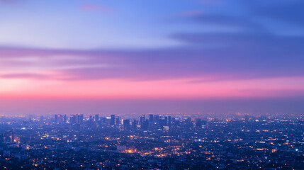 Obraz premium Stunning twilight cityscape panorama showcasing a vibrant, colorful sunset over a sprawling metropolis. City lights twinkle beneath a breathtaking sky.