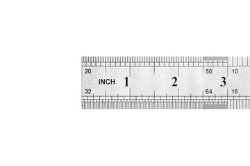 Close up of metal steel ruler is isolated on white background.