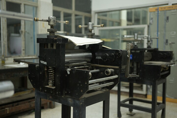 An etching press machine stands in a studio, ready for use. The Art of Printmaking, Crafting Creativity with an Etching Press