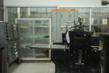 An etching press machine in a printmaking workshop, A Tool for Precision in Printmaking