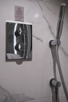 Modern interior design inside bathroom with sink and faucet inside cabin stateroom onboard luxury cruiseship cruise ship liner