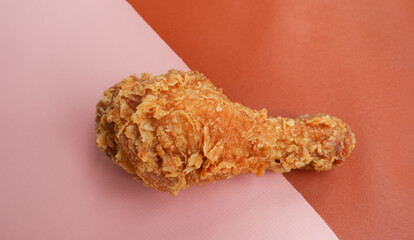crispy kentucky fried chicken in a pink brown background