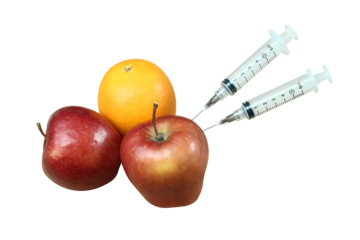 syringe fruit of red apple and orange as healthy food containing mineral and vitamin c