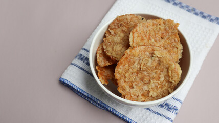 Keripik Tempe or Tempe chips, a typical Indonesian food made from thinly sliced ​​tempeh and then fried using seasoned flour. It's salty and savory. Close up