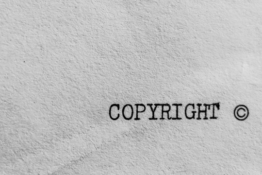 Copyright Text Only Type Typewriter Text Black and White on White Old Textured Paper Author Protected Book 