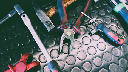 Vintage worn from time and frequent use mechanical tools on a workbench. Old tools for workshop stock image

