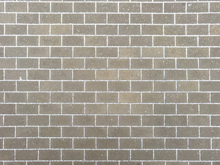 A brick wall with a gray color