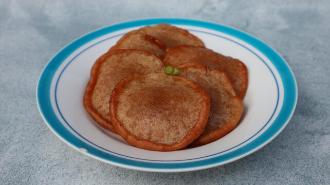 Kue Kucur or Kucur or kuih cucur, and called khanom fak bua or khanom jujun in Thai, is a traditional snack in Southeast Asia, including Indonesia, Malaysia and Southern Thailand, close up view