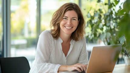 Smiling woman working on laptop in modern office with plants, remote work concept, professional lifestyle, and home office productivity.