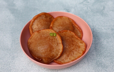 Kue Kucur or Kucur or kuih cucur, and called khanom fak bua or khanom jujun in Thai, is a traditional snack in Southeast Asia, including Indonesia, Malaysia and Southern Thailand, close up view