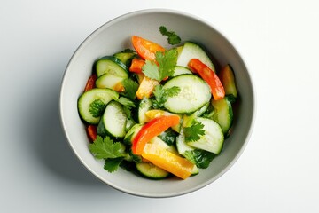 Fresh salad featuring vibrant cucumbers, colorful peppers, and h