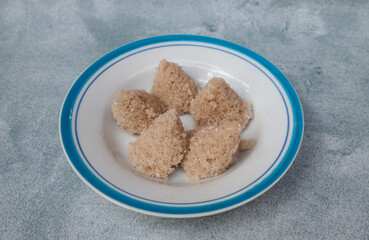 Tiwul, a traditional Indonesian food, is a staple food substitute for rice made from cassava....