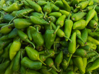 Chili is a spicy, flavorful pepper used to enhance taste and add heat to dishes. Chili display in market place for sale, colorful picture for social media