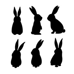 A set of black silhouettes of rabbits in different poses on a white background. Vector illustration.