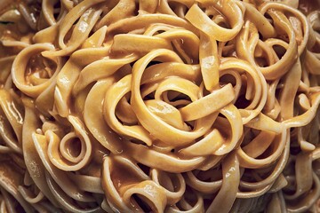 appetizing photo of a beautifully presented golden-yellow pasta dish