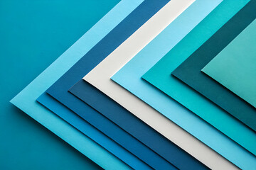 Obraz premium Abstract Gradient Of Blue Paper Sheets Arranged On A Dark Blue Textured Surface