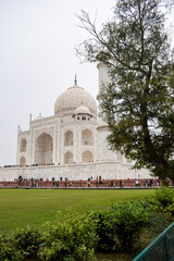 Amazing view of Taj Mahal which is among seven world wonders. Famous Indian Islamic heritage at cloudy day, Taj Mahal located at south bank of the Yamuna River