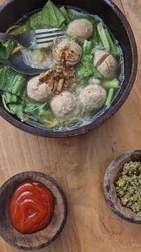 bakso is indonesian food. A bowl of meatball at table.