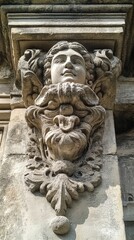 Naklejka premium Intricate Stone Carving on a Building Facade