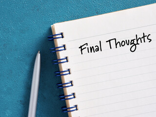 Notebook with final thoughts text written on first page with pen aside